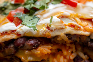 Close up on a juicy burrito from a mexican meal 