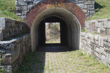 Fototapeta na wymiar Colonial Arched Brick Passageway