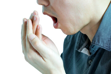 Fototapeta premium Oral health Men use hands to check for bad breath and breathe.