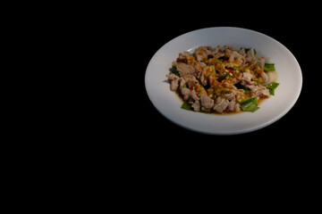 Spicy pork salad very delicious Thai food in the lunch time, Black background you can create.