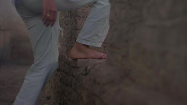 girl walking in tumb legs closeup visiting the historical archaeological site