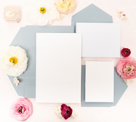 Blank Bridal stationery invitation flat lay with fresh flowers