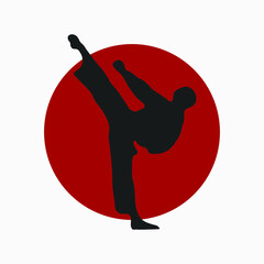 An vector silhouette of karate kick. Martial art vector illustration. Japanese rising sun. © Adam