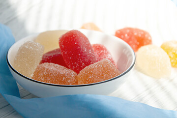 Multi-colored marmalade on the table. Jelly candy with sugar on top.