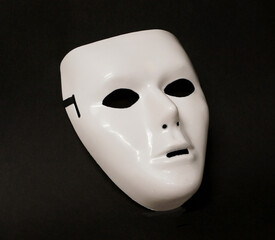 Theatrical mask set at an angle to give the viewer an impression of eye movement.