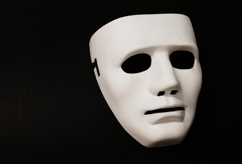 Theatrical mask set at an angle to give the viewer an impression of eye movement.