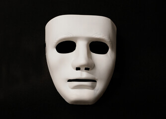 Theatrical mask set at an angle to give the viewer an impression of eye movement.