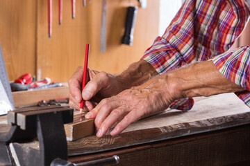 Carpenter working on the work bench, joinery tools and woodwork