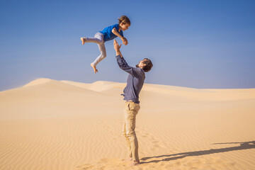Father and son at the white desert. Traveling with children concept. Resumption of tourism after...
