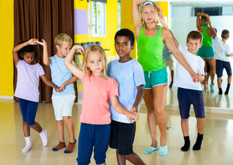 Little boys and girls dancing pair dance in the ballet studio. High quality photo
