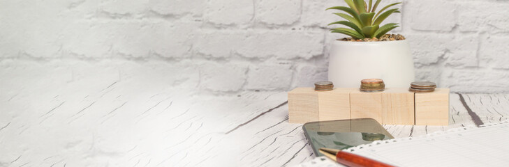 Stock market, coins, calculator, notepad, pen, and smartphone, and financial chart. Banner with a copy of the space and space for the text