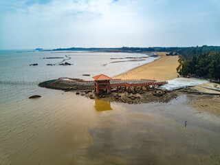 Beach and sea pier under the sunset by the sea