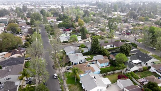 Drone perspective over district of Van Nuys city, Los Angeles. Aerial forward
