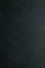 dark creative background: black primed linen canvas, uneven lighting, color toning