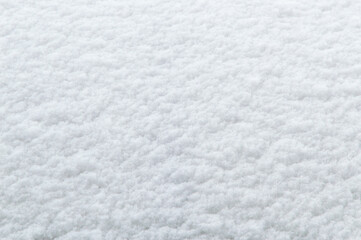 winter background: fresh clean even snow, large snowflakes