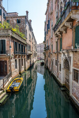 Small canal in the old town of Venice, Italy