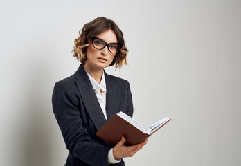 Woman in classic suit short haired glasses model business finance.