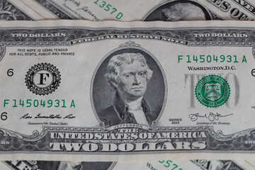 2 US dollar banknote on 1 dollar banknotes