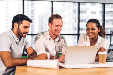 Group of professional business meeting and discussing strategy with new startup project.Creative business people planning and brainstorm with laptop computer in modern workloft.Teamwork concept