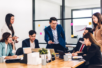 Group of professional business presentation meeting and discussing strategy with new startup project.Creative business people planning and brainstorm with laptop computer in modern office.Teamwork