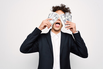 man in a suit a bundle of money in the hands of a businessman self-confidence