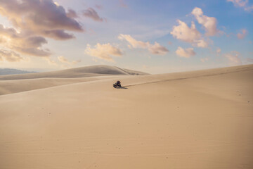 Fototapeta na wymiar Rent a car for driving on the sand dunes. 4 wheel drive sand car