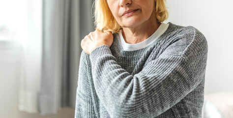 Sick senior adult elderly women touching the neck have shoulder and neck pain.Healthcare and...