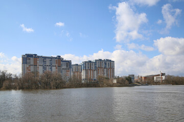 Residential complex by the river in the spring.