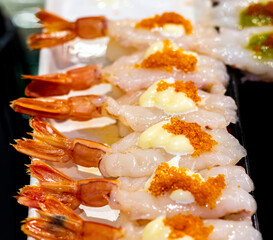 Japanese food of sushi shrimp and flying fish roe on mayonnaise