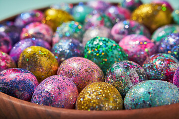 Many colorful shiny eggs. Concept of Happy Easter.