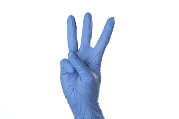 Obraz premium Hand in medical glove show three fingers isolated on white background