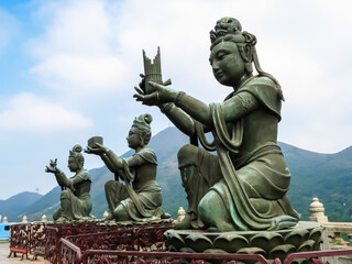 Fototapeta na wymiar Devas (Buddhist beings) on the steps of the ladder leading to the Big Buddha