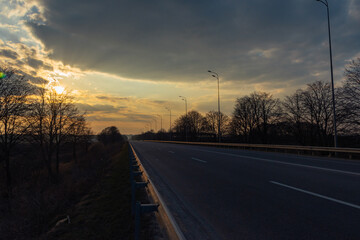 sunset with clouds over the highway 