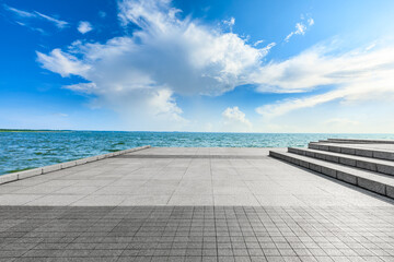 Empty square floor and lake landscape under the blue sky.