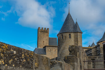 Fototapeta na wymiar View over the historical castle carcassone - cite de carcassone - with the towers, background blue sky