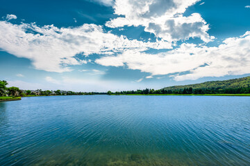 Blue lake and green mountain landscape.