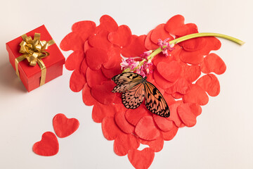 A symbol of love, health. The large sergeant on a white background consists of small paper hearts,...