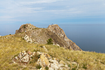 Baikal Lake in summer. Cape Shunte-Left, famous among tourists, or as it is also called the Cape of Love, is a natural attraction of Olkhon Island. Summer travels and holidays. Natural background