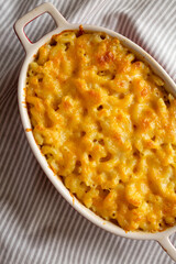 Homemade Macaroni and Cheese Pasta on cloth, top view. Flat lay, overhead, from above.
