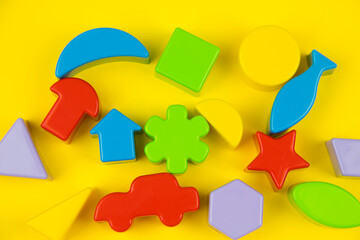 children's educational toys on a bright yellow background.