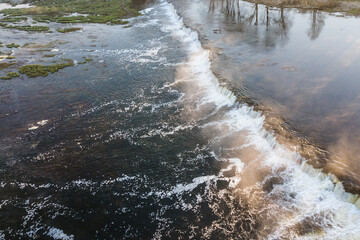 Venta waterfall in the fog, Kuldiga, Latvia. Captured from above.