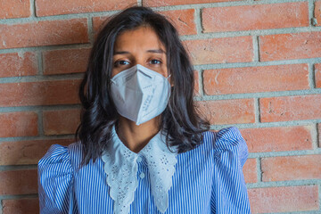 Young indian woman wearing a mask