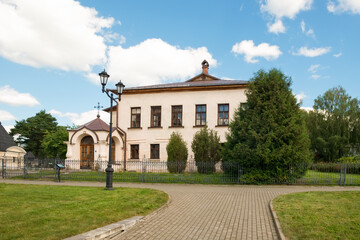 Fototapeta premium View of the stone two-story abbot building (1530s) with a fraternal refectory, kitchen and cells. Holy Dormition Monastery, Staritsa, Tver Region.