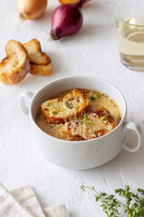 French onion soup with toasts and cheese. French cuisine. Vegetarian food.