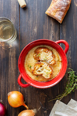 French onion soup with toasts and cheese. French cuisine. Vegetarian food.