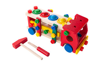 Truck made of wood on a rope. Constructor game and hammer with a hammer for children. Educational toy Montessori 3 in 1 White background. Close-up.