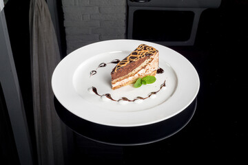 One slice of bird milk cake on a white plate