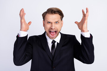 Photo of young man unhappy upset angry mad crazy shout scream problem isolated over grey color...