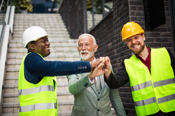 The construction site boss with the architects.