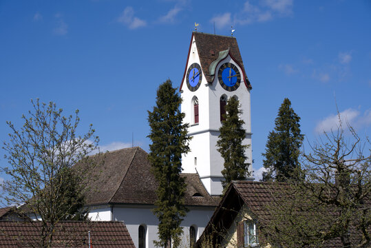 Church tower of protestant church of village Hinwil, Switzerland. Photo taken April 8th, 2021.